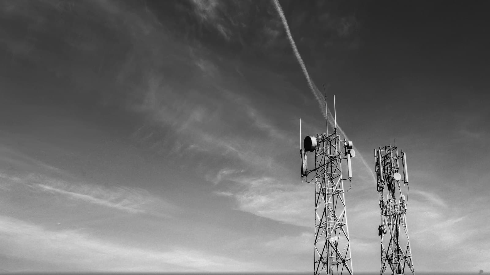 Cellular towers against the sky