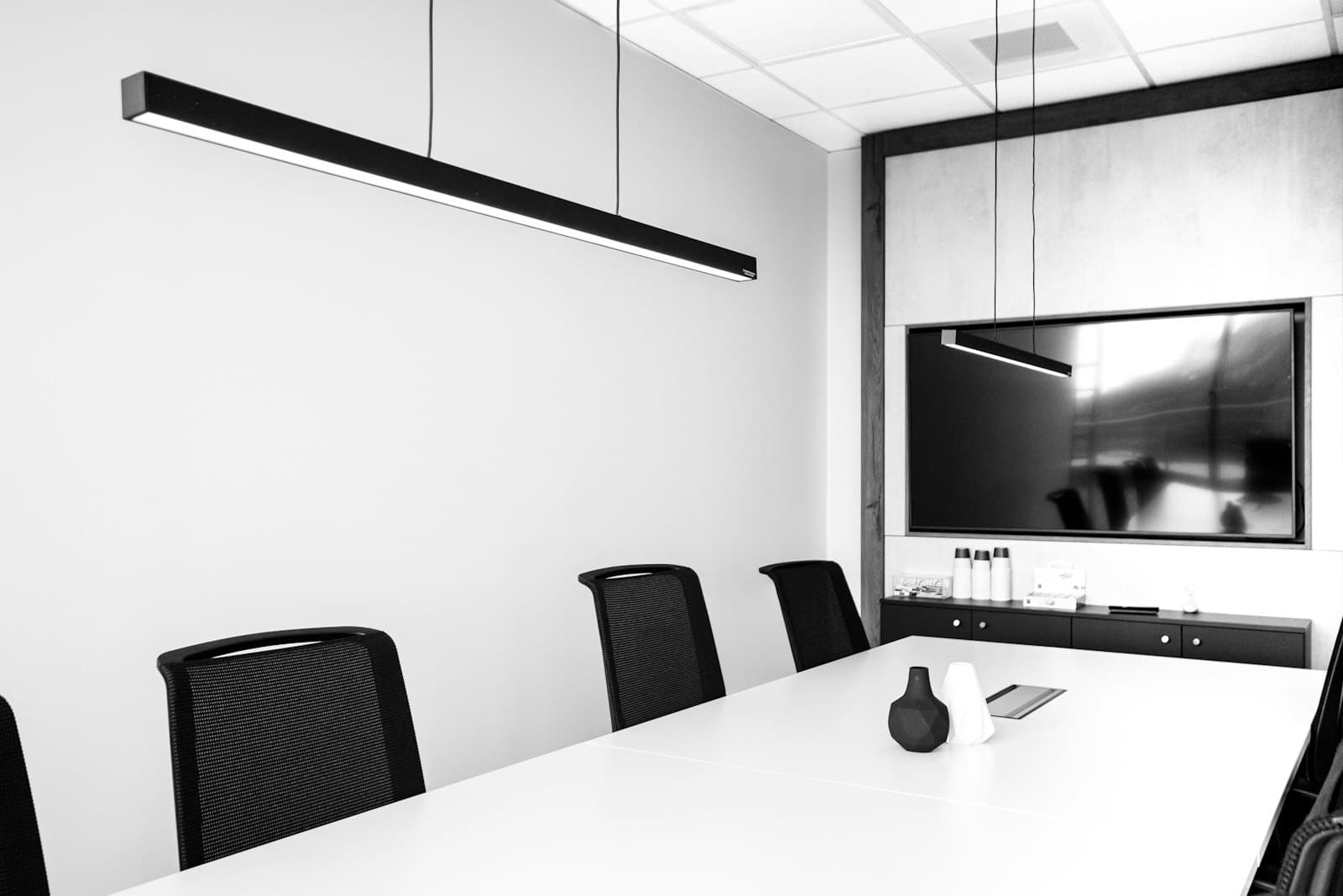 A conference room with a table and chairs