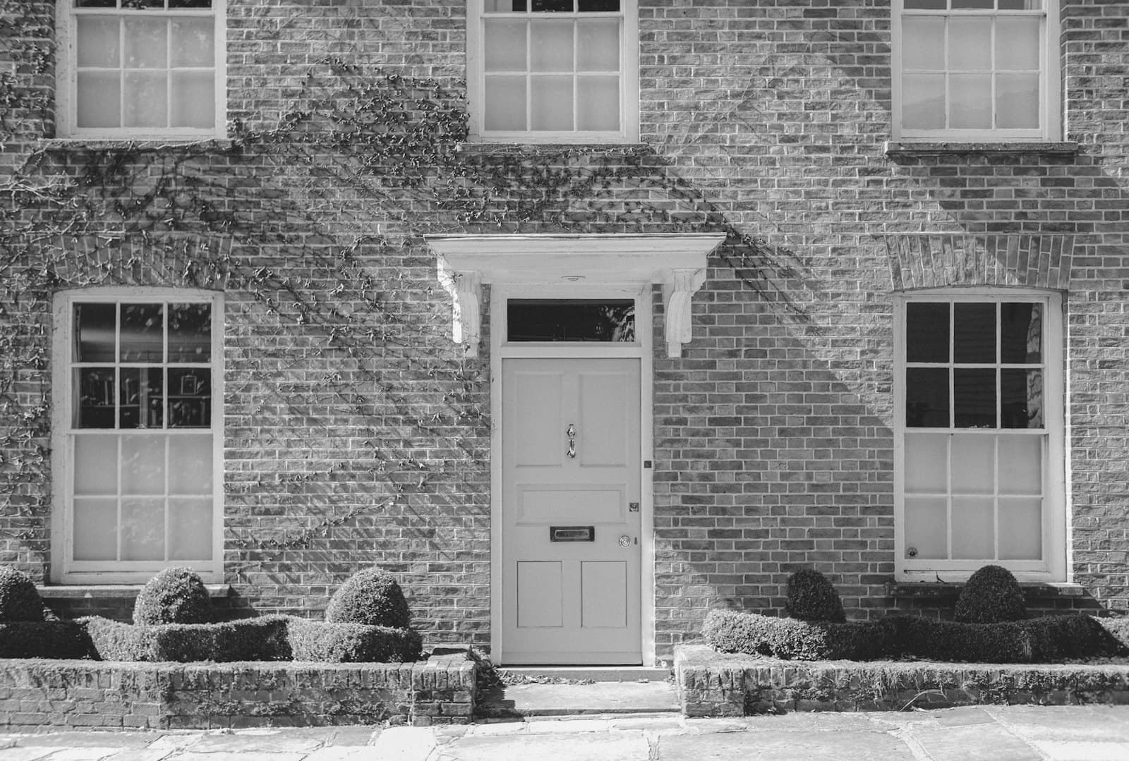 The front door of a brick townhouse