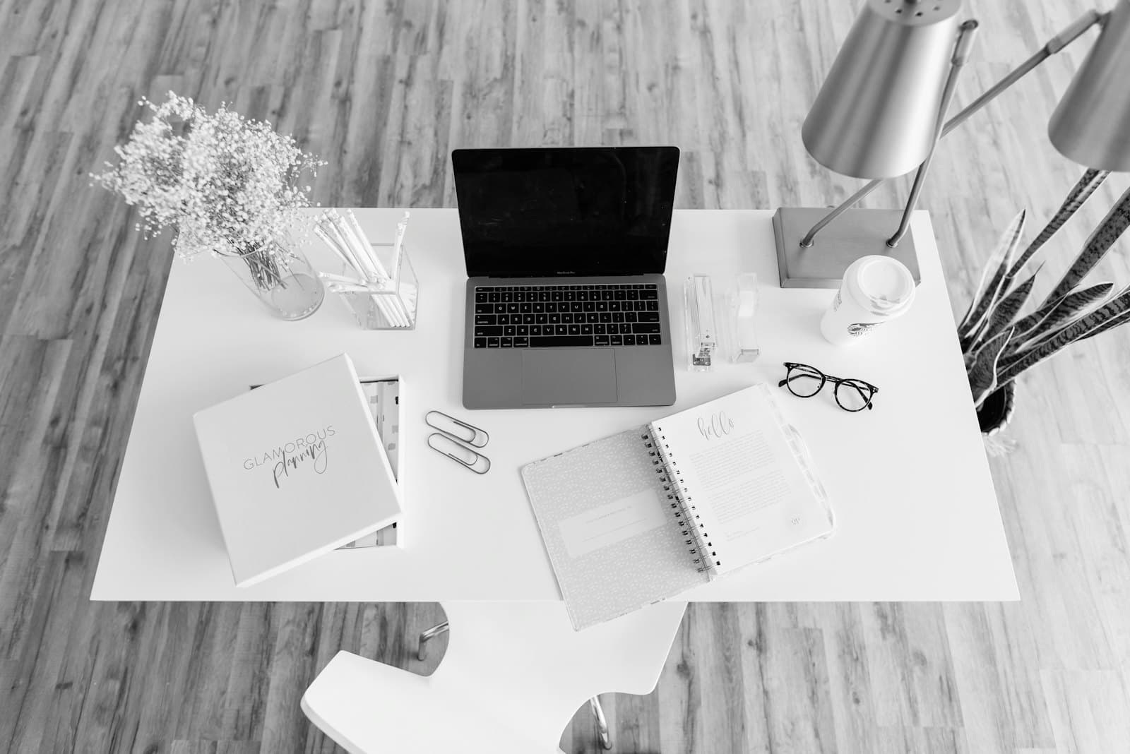A laptop on a tidy white desk