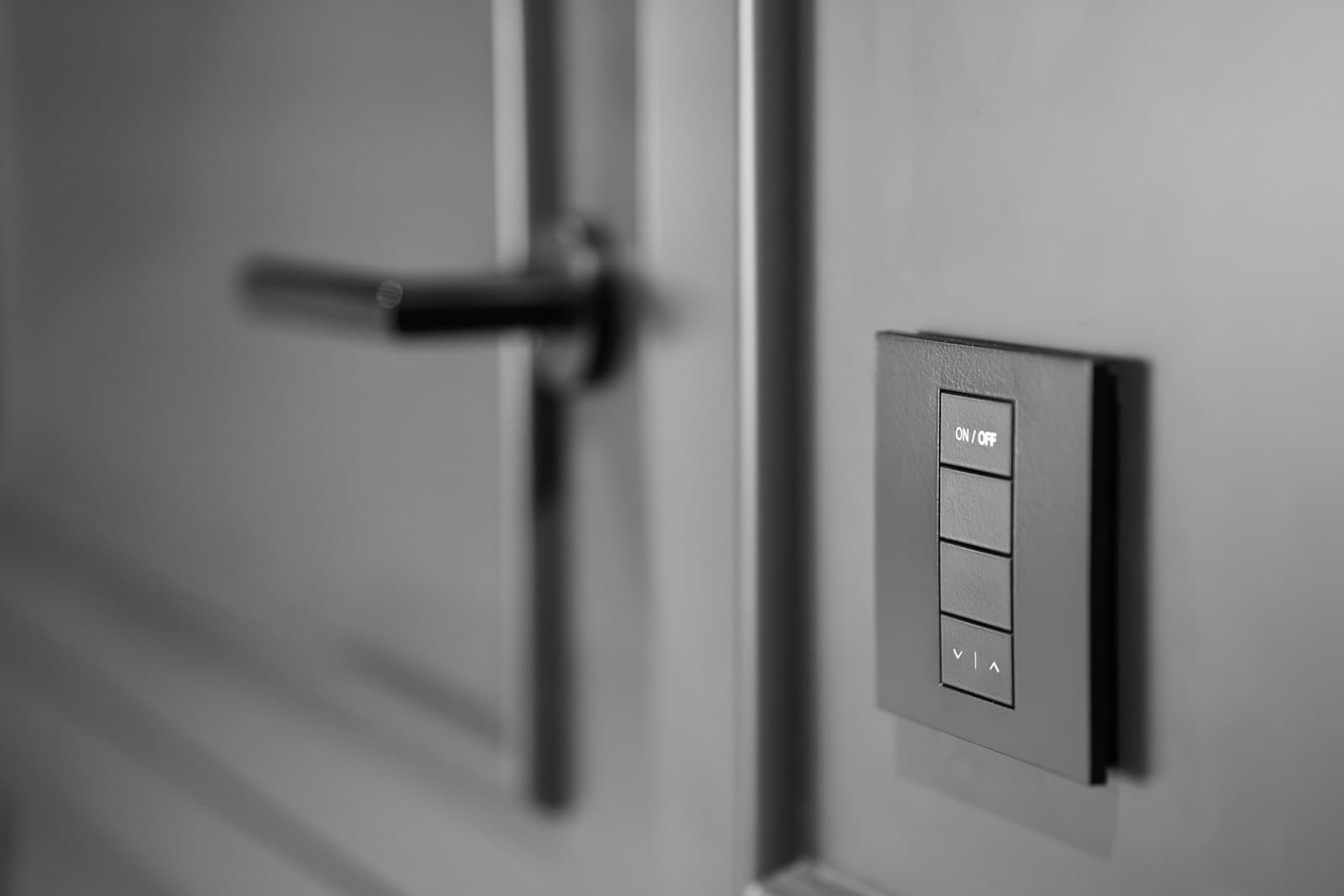 A keypad light switch on a wall