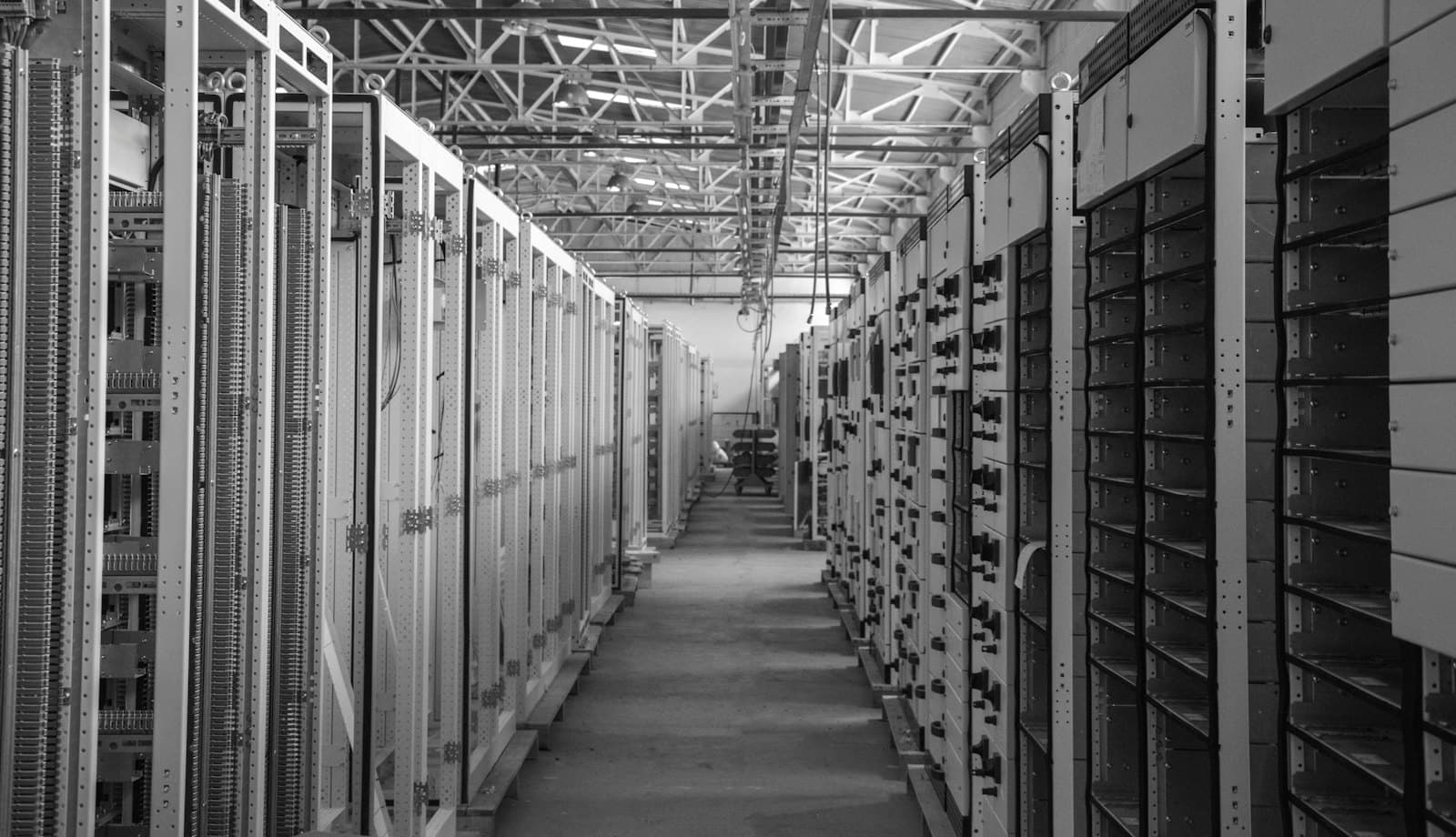 An aisle of network equipment racks